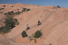 Mountain biking the Slickrock Trail near Moab, Utah; established in 1969 for motorcycling A283, Slickrock Bike Trail, Moab, Utah, USA, 2008.JPG