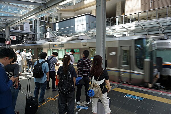 A JR West 223 series train arriving in Osaka station