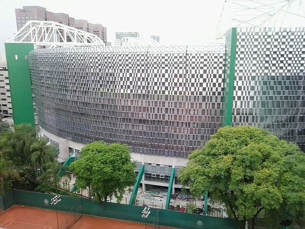 External view of Allianz Parque behind the tennis courts of Sociedade Esportiva Palmeiras
