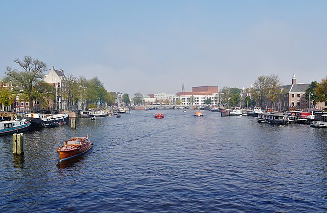 The Amstel in city center of Amsterdam with the Stopera (center) and H'ART Museum (right)