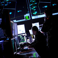 USAF Battle Control System operators monitor the skies from the floor of the program's Eastern Air Defense Sector location.