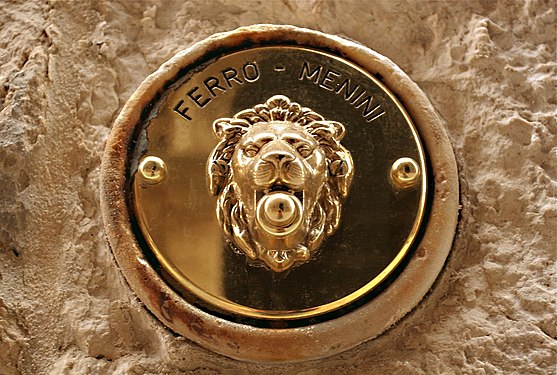 Bell button beside an entrance door in Venice, Italy