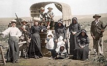 Boer family traveling by covered wagon circa 1900 Boer Family with a wagon - false colour image.jpg