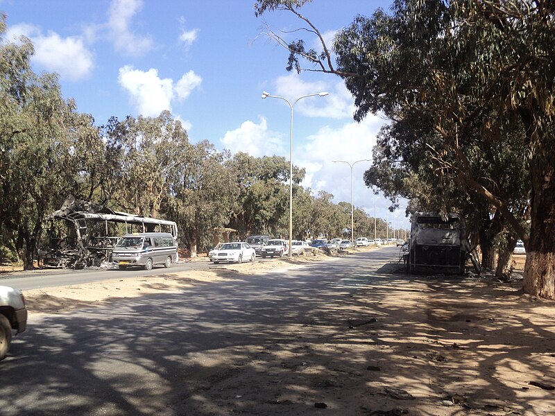 File:Burned buses near Garyounis university Benghazi.JPG