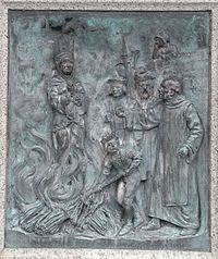 "Agnes Prest burnt upon Southernhay AD 1557". 1909 Bronze relief sculpted panel by Harry Hems showing burning at the stake of the Protestant martyr Agnes Prest in 1557, on the base of the Protestant Martyrs' Monument, Denmark Road, Exeter, Devon BurningOfAgnesPrestExeterMartyrsMonument.jpg