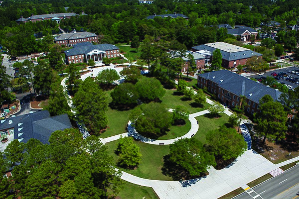 Framed by Blanton Park, the Edward M. Singleton Building was the first building on campus, built in 1963.