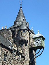 The clock with bartizans to either side and the conical spire Canongate Tolbooth clock - geograph.org.uk - 1339785.jpg