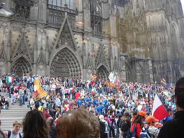 A view of the celebratory vibe outside the Cologne Cathedral in Germany (2005). The participation of Catholics from many countries worldwide results i