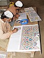 Correctional Activities at Central Jail Faisalabad, Pakistan in 2010 - Convict artists busy in drawing designs of carpets on graph papers.JPG