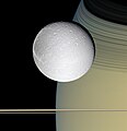 Dione and Saturn at Dione, by Cassini orbiter