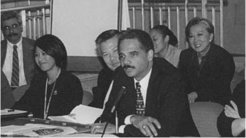 Holder opening an Interagency Working Group meeting of the White House Initiative on Asian Americans hosted by the Department of Justice on October 18, 2000.