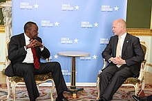 Kenyatta talking at the Somalia Conference in London 2013 Foreign Secretary William Hague with President Kenyatta of Kenya at the Somalia Conference in London, 7 May 2013. (8717455000).jpg