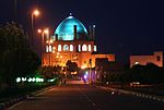 Octagonal building with turquoise dome.