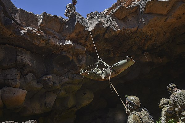 Special Tactics Pararescue Aircrew, Jordanian Armed Force Special Task Force, and Italian special operations forces pull a simulated casualty out of t