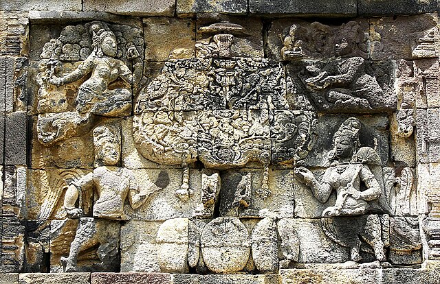 Kalpataru, the divine tree of life being guarded by mythical creatures at the 8th century Pawon temple, a Buddhist temple in Java, Indonesia.