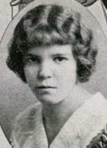 A young white woman with wavy hair cut in a bob with short bangs
