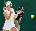 Katie Swan competing in the first round of the 2015 Wimbledon Qualifying Tournament at the Bank of England Sports Grounds in Roehampton, England. The winners of three rounds of competition qualify for the main draw of Wimbledon the following week.