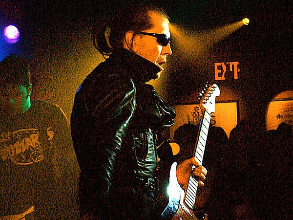 Link Wray, pictured in 1993, who helped pioneer the use of guitar power chords and distortion as early as 1958 with the instrumental, "Rumble", has be