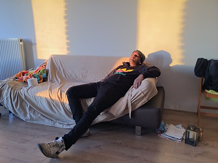 A man relaxing on a couch