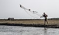 Man throwing a fishing net