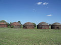 Round brick buildings on US 41, south of the intersection of US 41 and County Road 328, near Romeo. There are a total of 8 of them in a row. Maybe 10 feet tall, not too much bigger than that in diameter