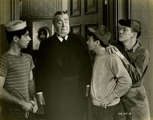 Bobby Stone, Robert Greig, Leo Gorcey, and Huntz Hall in the film Million Dollar Kid (1944).