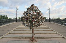 One of many purpose-built iron trees on a bridge across the Vodootvodny Canal in Moscow, completely covered in love padlocks Moscow-love-padlocks.jpg