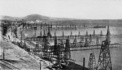 A picture of the Summerland Oil Field, the location of the world's first offshore oil well, c. 1915 Oil wells just offshore at Summerland, California, c.1915.jpg