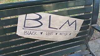 BLM sign on a park bench