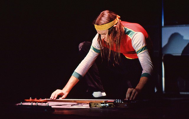 Pastorius, reaching to accentuate his bass guitar sound with harmonics