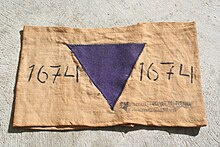 The purple triangle was a concentration camp badge used by the Nazis to identify Jehovah's Witnesses in Nazi Germany. Purple Triangle.JPG