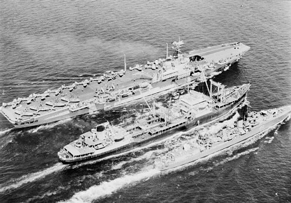 RFA Wave Sovereign resupplying HMCS Nootka (right foreground) and HMS Ocean (left background) off Korea in 1952.