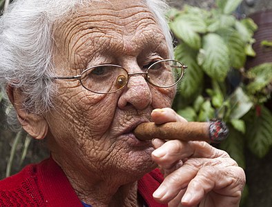 An old woman's portrait smoking tobacco