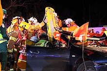 Crews extricate a patient from a simulated motor vehicle accident as part of a training exercise. Road Crash Rescue Training Exercise.jpg