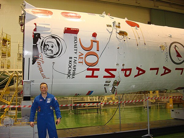 Garan stands in front of the Soyuz booster which bears the name and likeness of Yuri Gagarin.