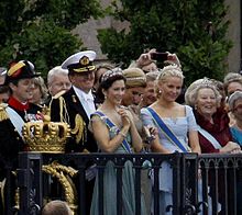 Mary attends the wedding of Crown Princess Victoria of Sweden. She is pictured here surrounded by (left to right): Frederik; Willem-Alexander of the Netherlands; Maxima of the Netherlands; Mette-Marit of Norway; and Beatrix of the Netherlands. Royal guest Wedding Victoria.jpg