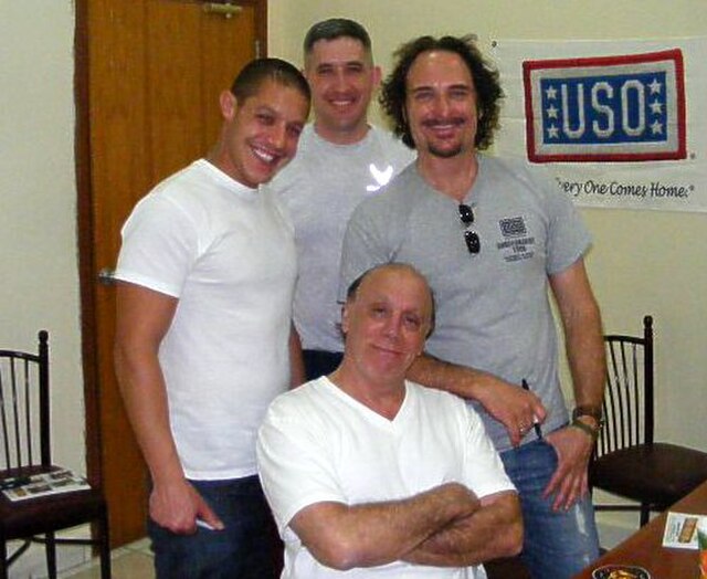 Coates (right) joins Theo Rossi and Dayton Callie on a USO visit to Southwest Asia.