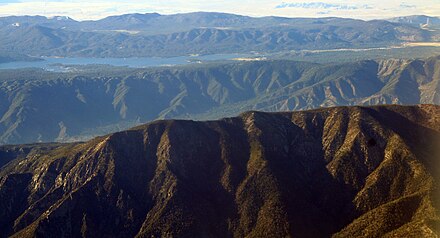 The Transverse Ranges were formed by uplift along the San Andreas Fault. Santa Ana Canyon is between the first and second ridges and Big Bear Lake is in the background.