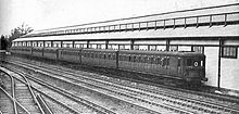 Electric multiple units at Orpington, 1928. Two 3-car units sandwich a 2-car trailer set. Southern railway electric units at Orpington (CJ Allen, Steel Highway, 1928).jpg