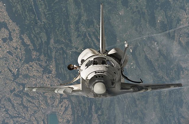 Space Shuttle Discovery photographed by Expedition 11 as it performed the first ever Rendezvous pitch manoeuvre.