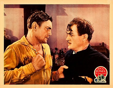 Lobby card with Buck Jones and Harry Woods in The Range Feud (1931)