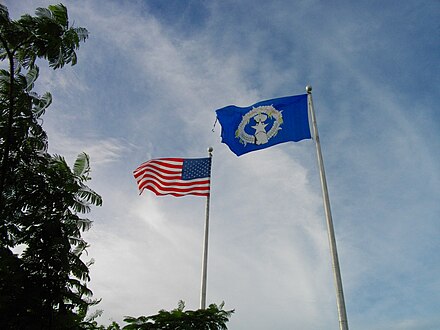 The U.S. and Northern Mariana Islands flags flying side-by-side