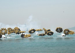 Amphibious vehicles deploying smoke grenades US Navy 100915-N-4894D-110 Marines participate in the 60th anniversary of teh Incheon Landing Operation.jpg