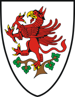 Similarly, the coat of arms of Greifswald, Germany, in Mecklenburg-Vorpommern, also shows a red griffin rampant - perched in a tree, reflecting a legend about the town's founding in the 13th century.