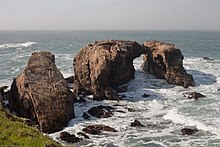 Arches and sea stacks of Miguelito shale, Point Buchon. Waterscape with massive arches and stone outcroppings of Miguelito shale, Point Buchon.jpg