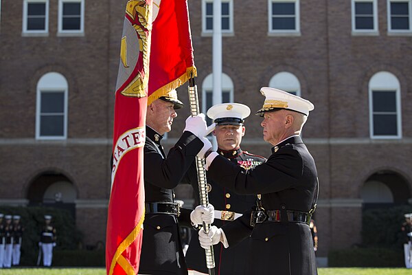 Amos exchanges the Battle Colors of the Marine Corps with incoming Commandant General Joseph Dunford on October 17, 2014