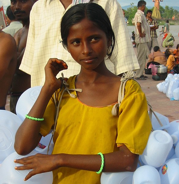 File:A girl selling plastic containers for carrying Ganges water, Haridwar (cropped).jpg