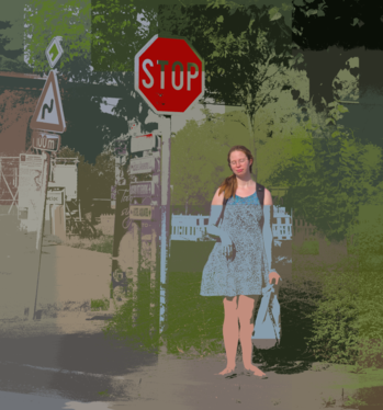 A person in blue standing next to a stop sign in Anseremme, Belgium (DSCF7416-gimped).png