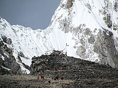 Near to the summit of KP, the summit is backdropped by the white snow of more distant mountains