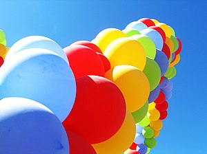 An arch of colourful party balloons.